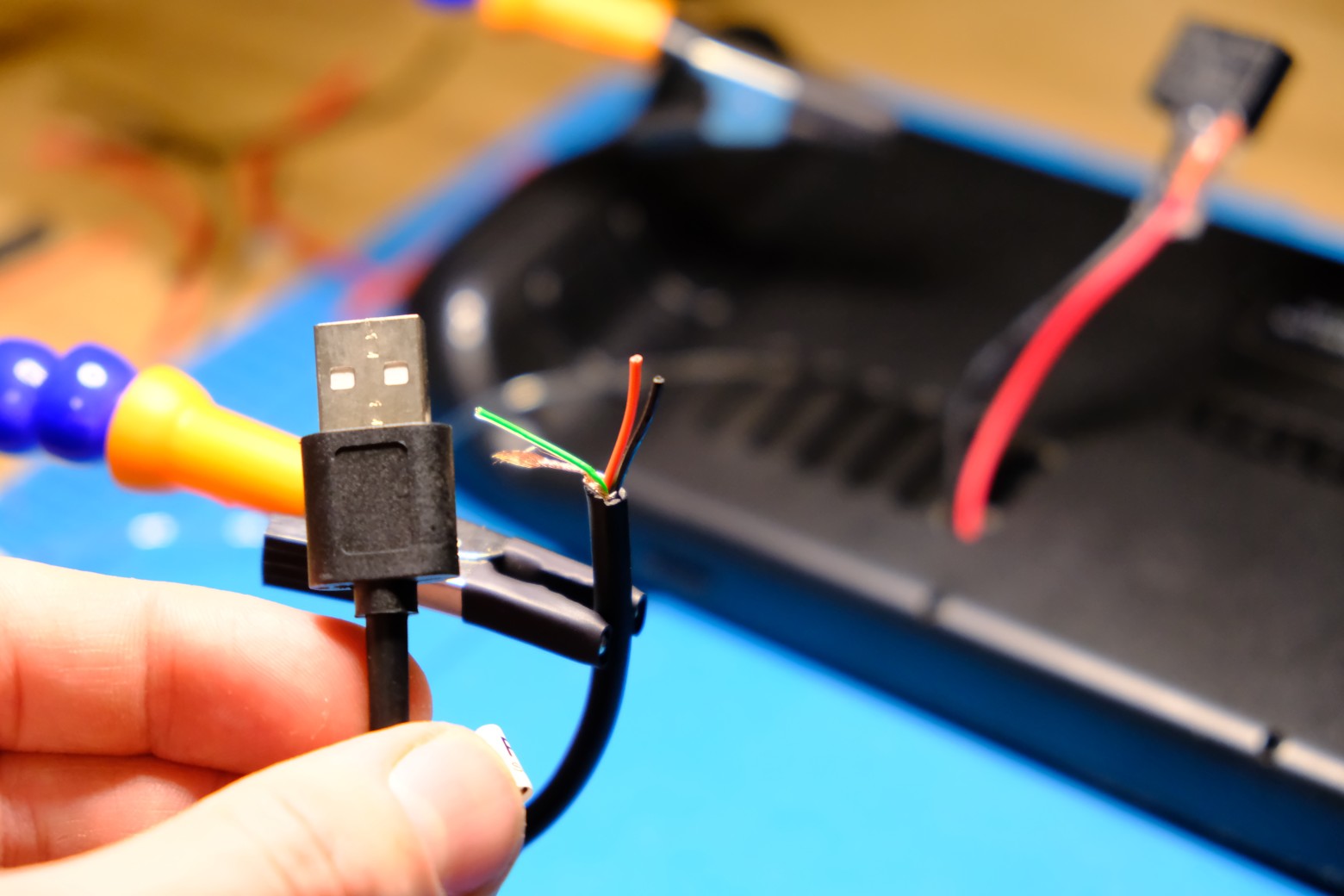 Cut the end of a USB-A cable, find the VBUS+ and GND wires
